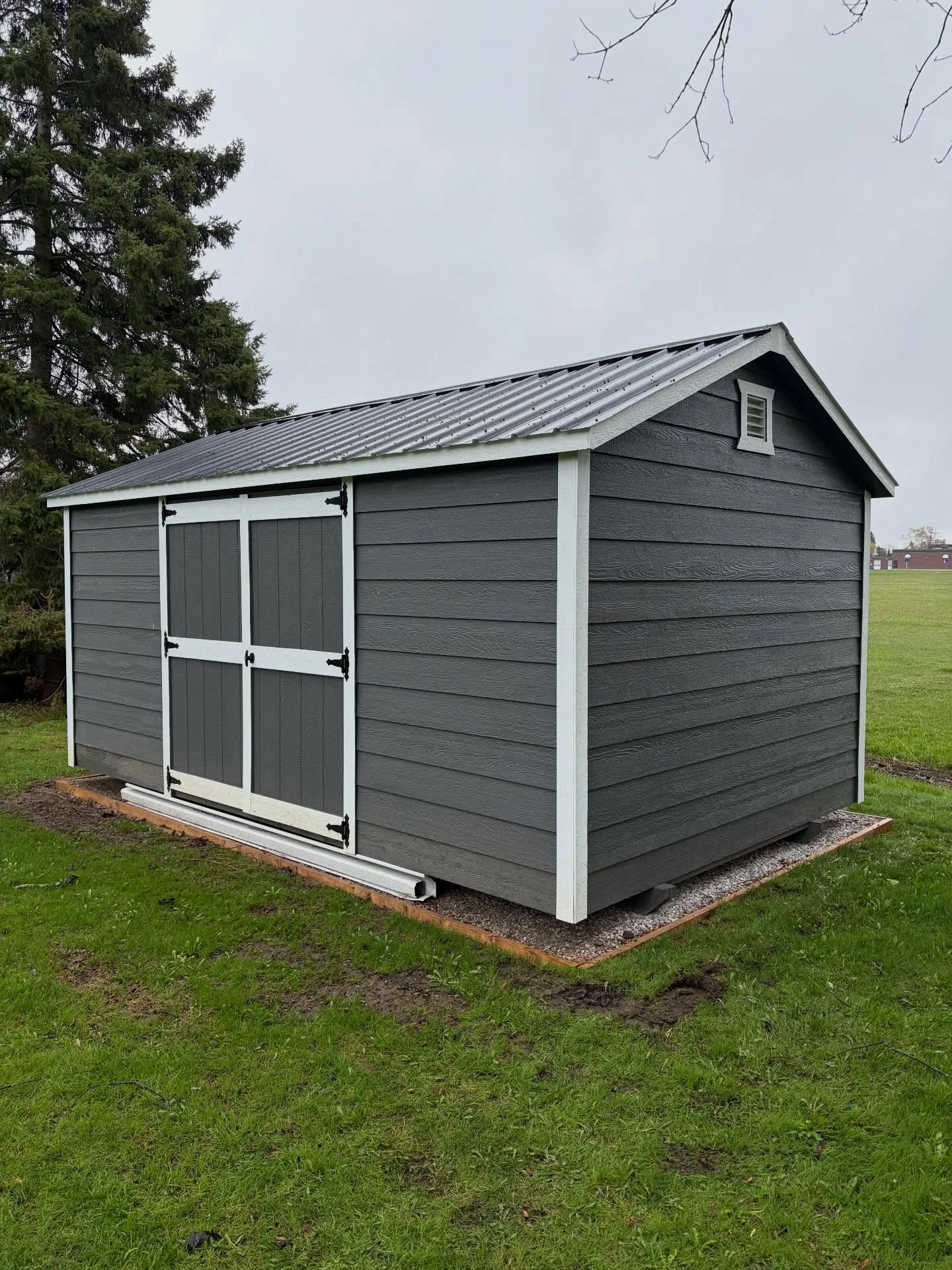 We’re back at it, turning a blank space around the shed into a brand-new focal point.