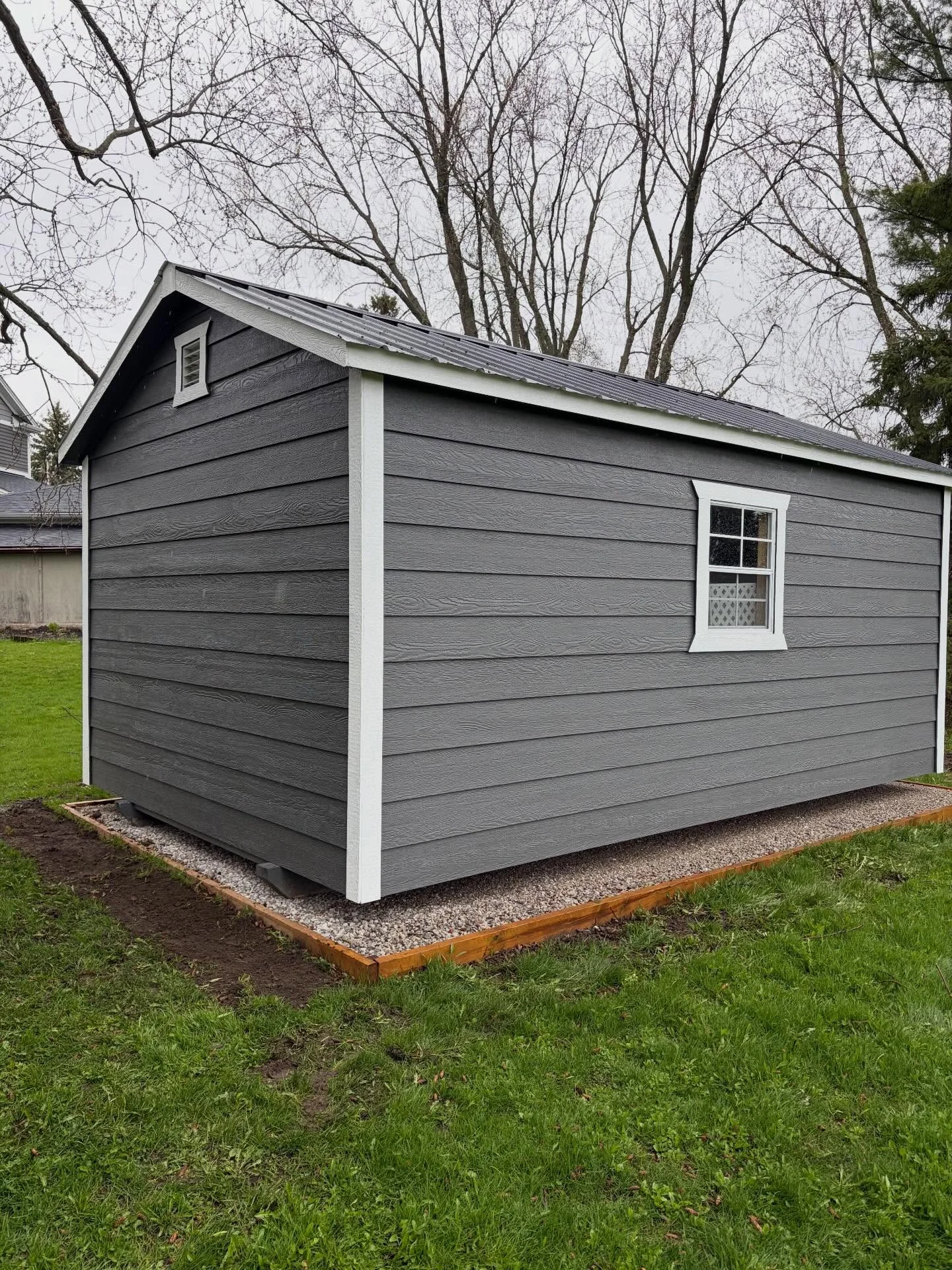 We’re back at it, turning a blank space around the shed into a brand-new focal point.