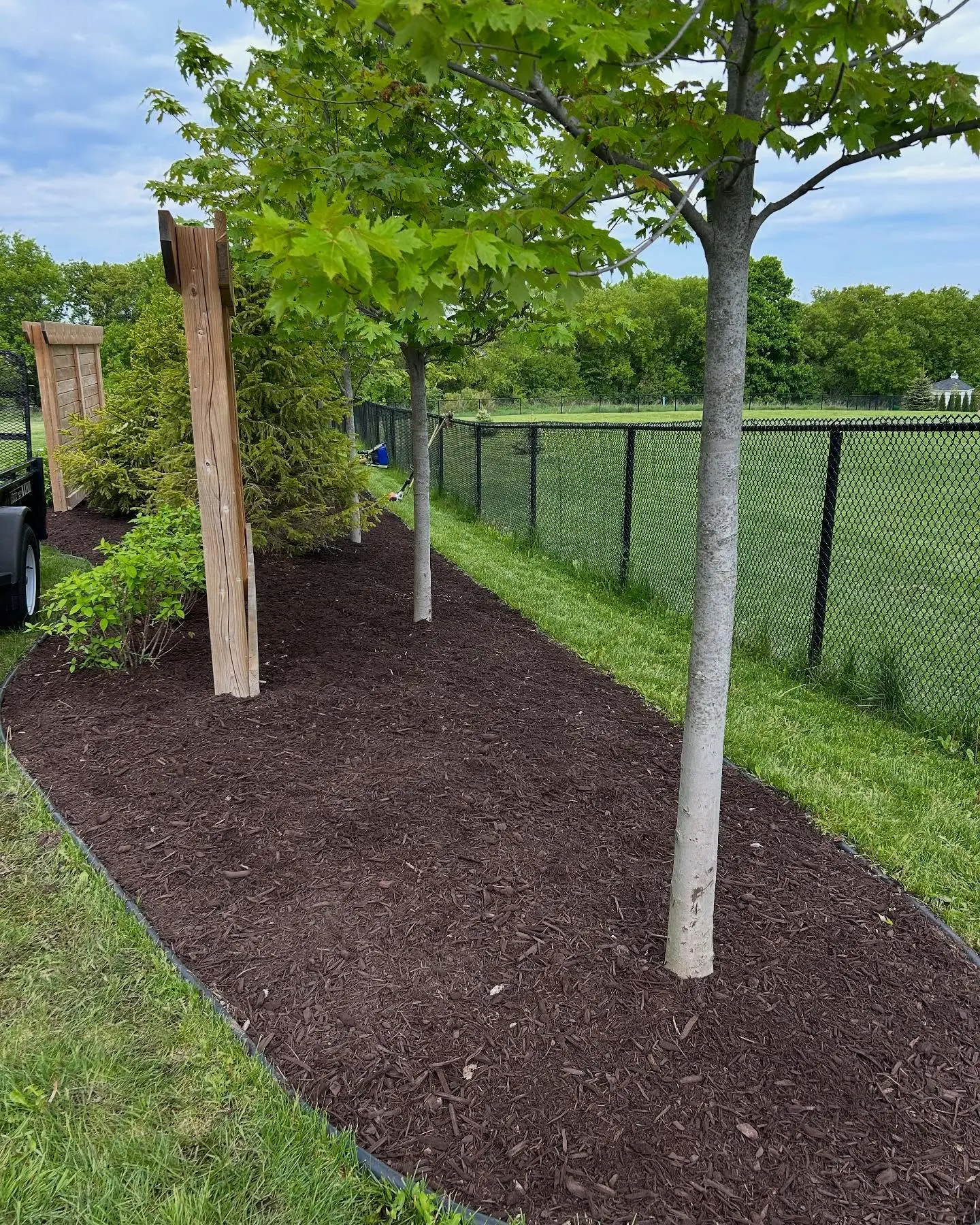 Completed a full garden bed refresh today with 8 yards of premium brown mulch.